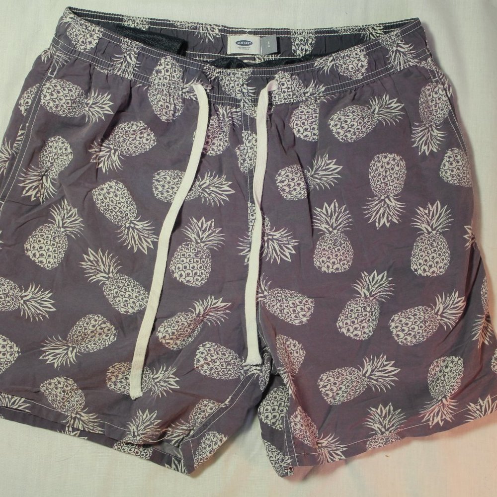 Purple pineapple swim trunks